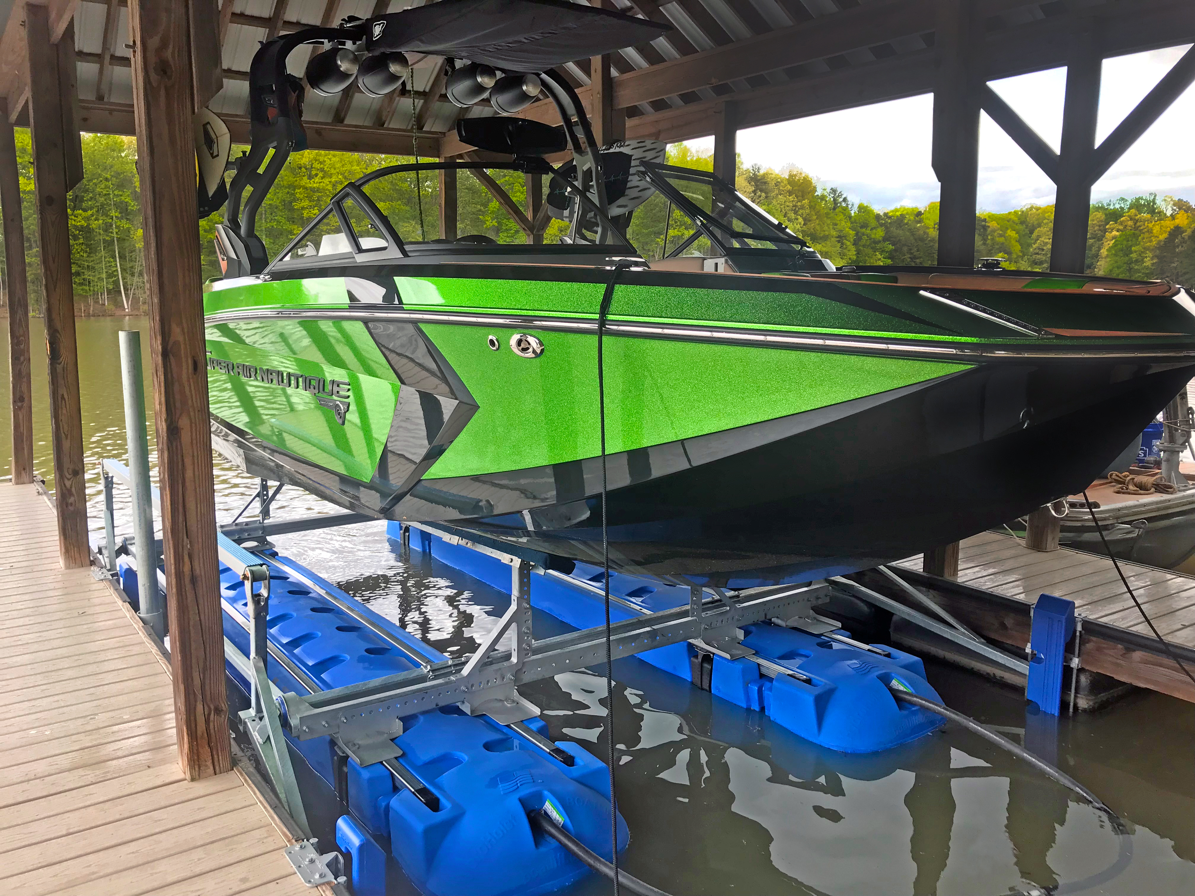 HydroHoist boat lift installed in a covered dock slip
